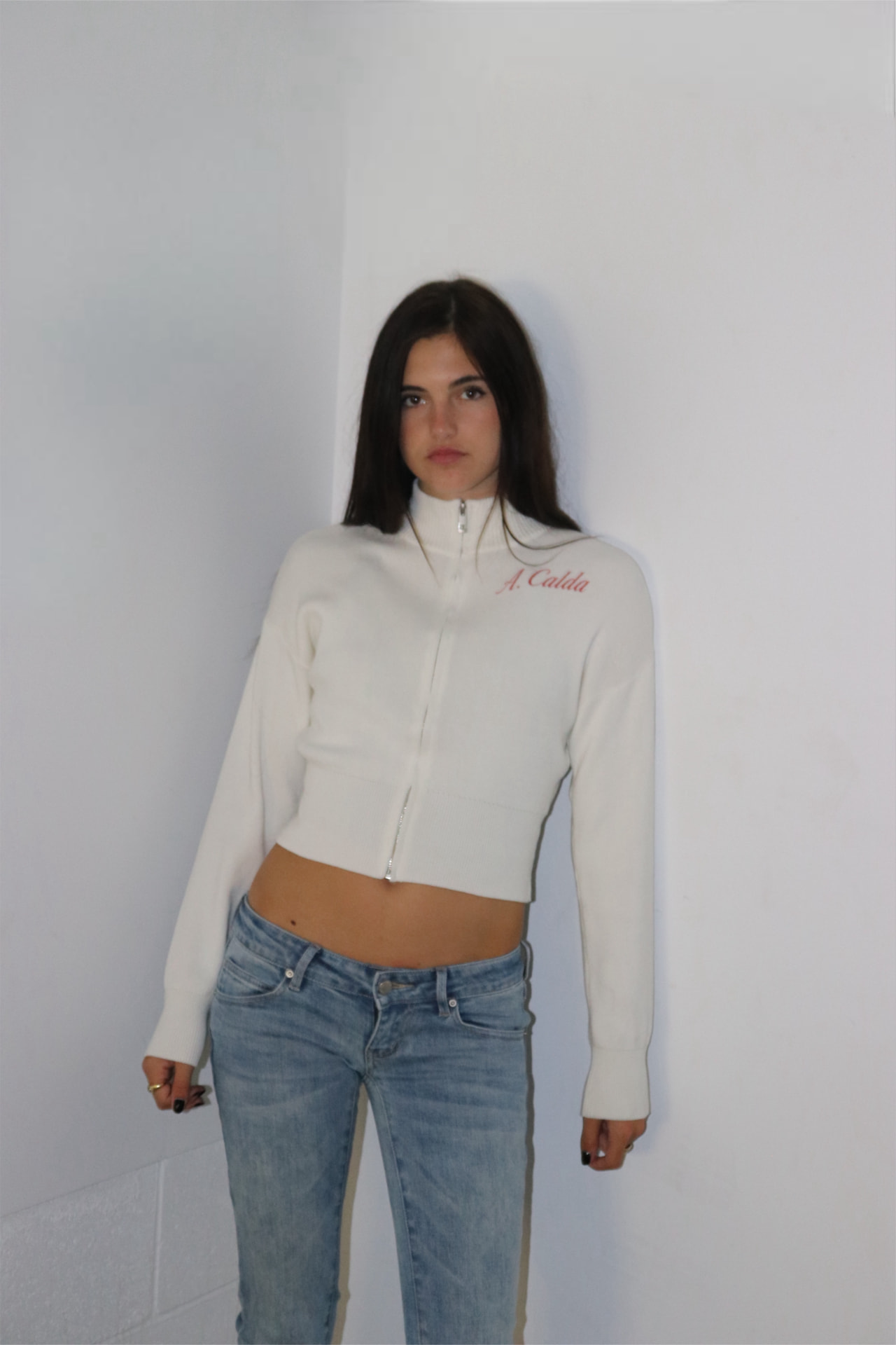 Model wearing the A. Calda Fitted Zip-Up in cream